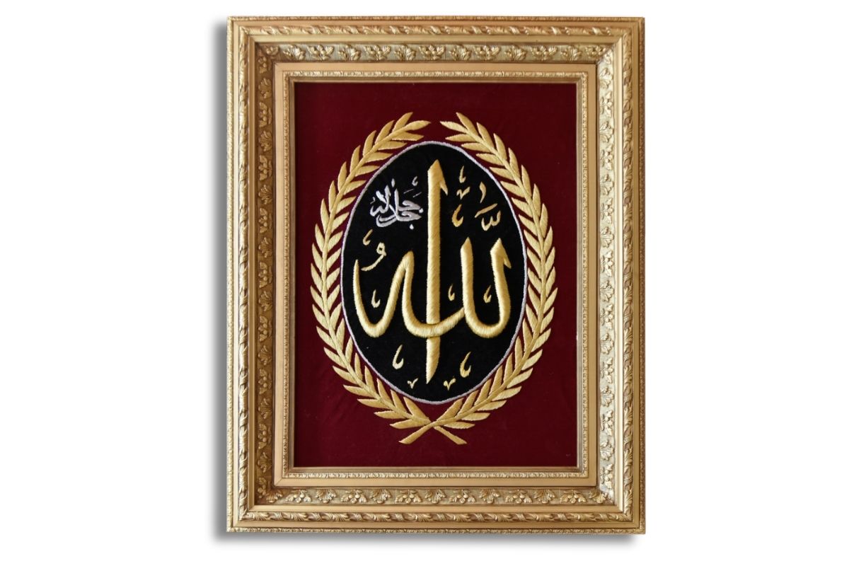 Add elegance to your space with this hand-embroidered Allah calligraphy in silk gold thread, set against a black and red velvet background and framed in luxurious gold. ready to hang, this masterpiece is perfect for Islamic home décor or gifting! Order Online at Handmade Egy for Free UK Delivery. Worldwide Shipping.